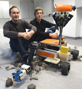 Explorer robot with Jrg Stckler (left) and Max Schwarz (right)