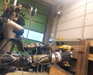 Centauro robot performing bimanual tool use