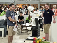 RoboCup@Home 2024 OPL Final: NimbRo robot talking to a jury member