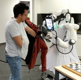 NimbRo Avatar Robot Helps Recipient into Jacket
